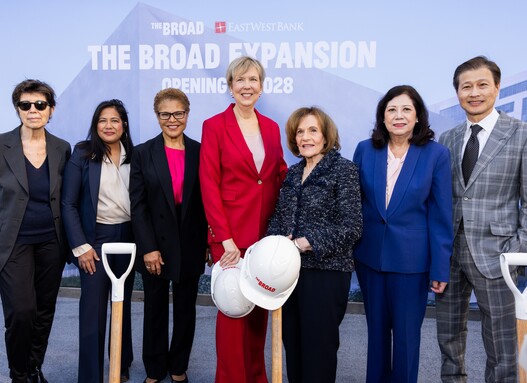 Group of people standing in front of a banner with The Broad Expansion 