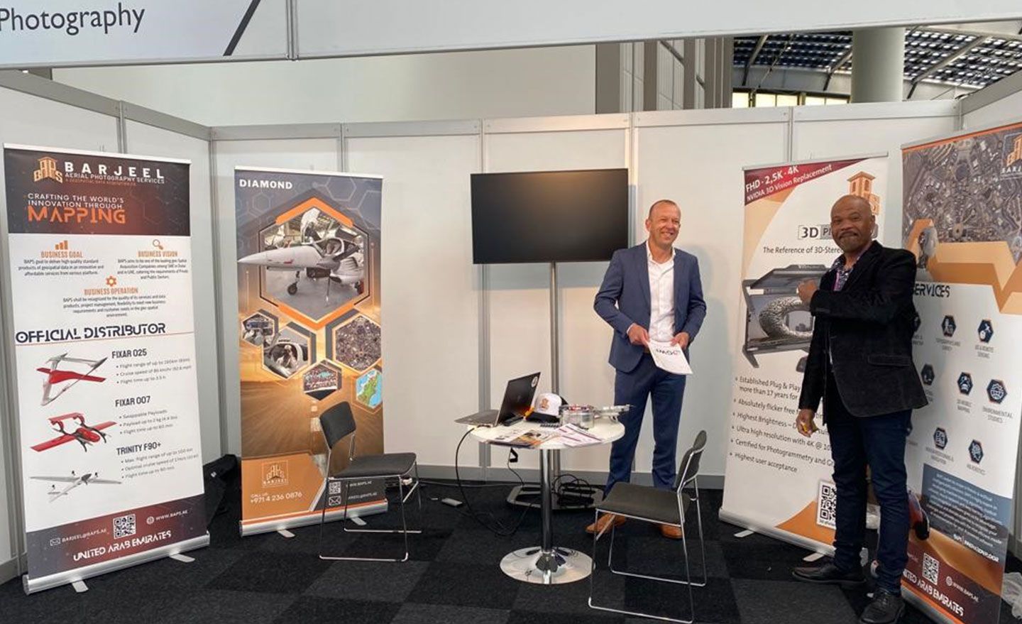 Trade show booth with geospatial technologies at the Geospatial World Forum conference.