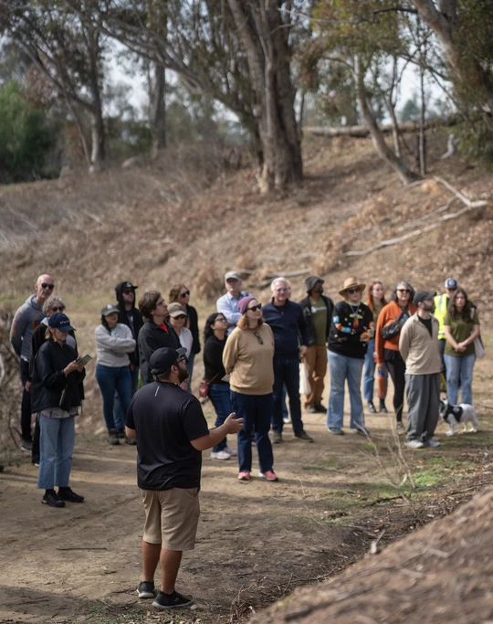 Man providing tour to a group of people of Elysian Park