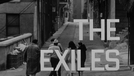 black and white film still with four people in a street with the film title overlaid